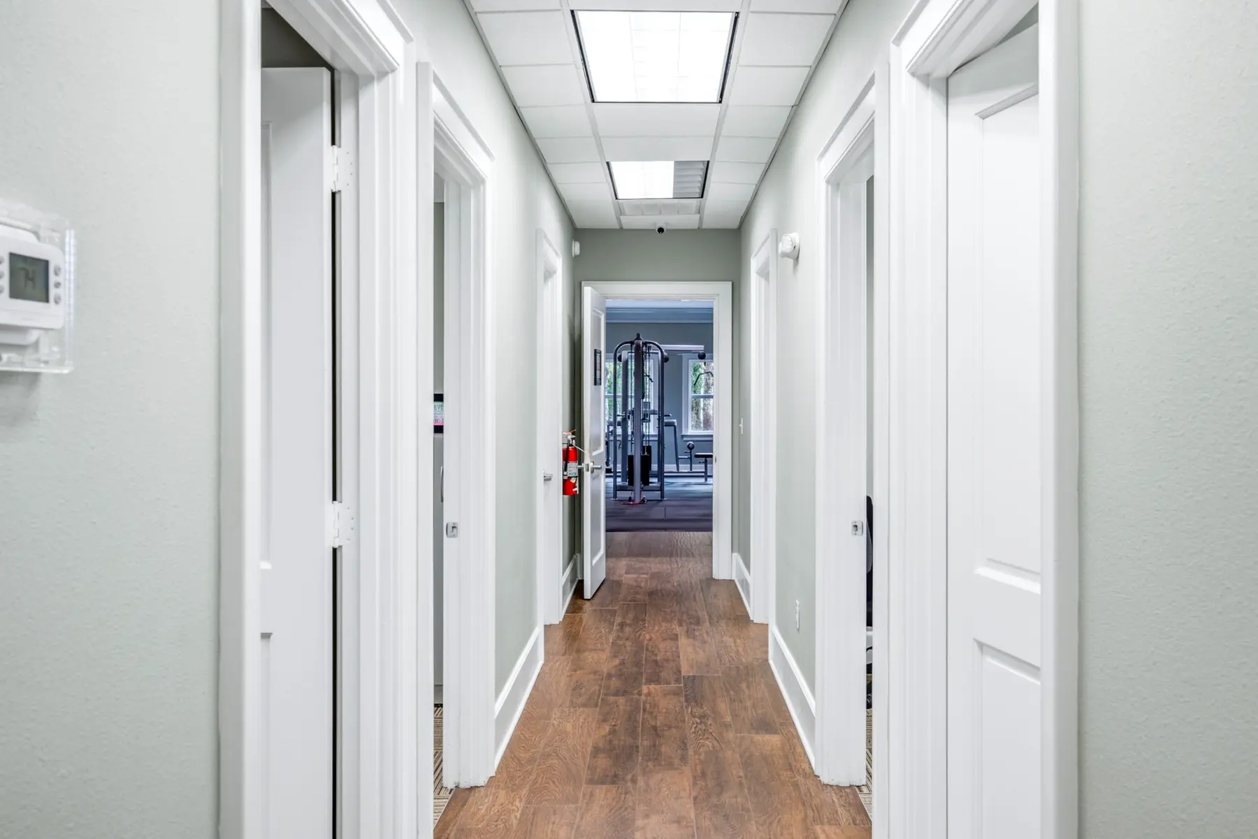 Hallway with private office doors inside Cadenhead Legacy Center