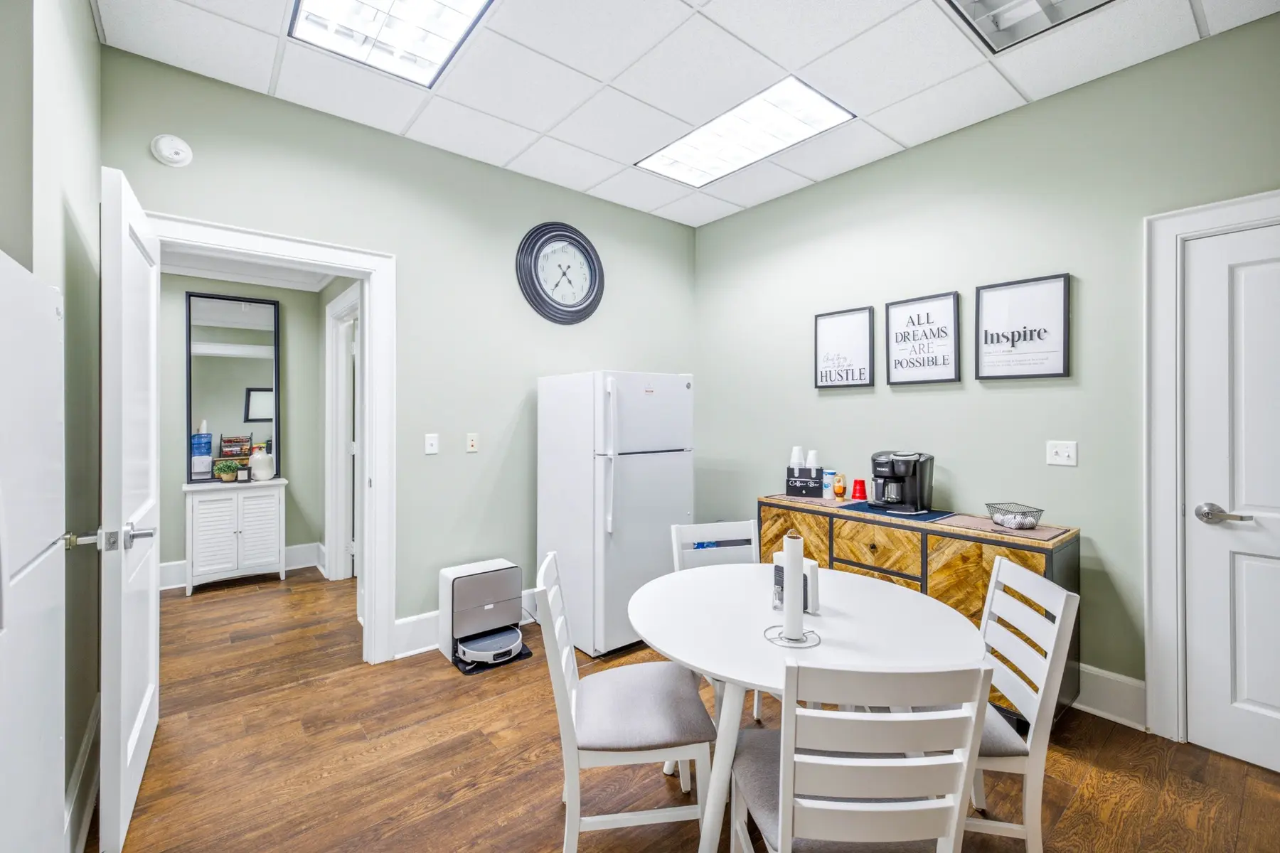 Shared kitchen and common area with a round table at Cadenhead Legacy Center